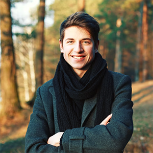 Man in a black scraf in forest