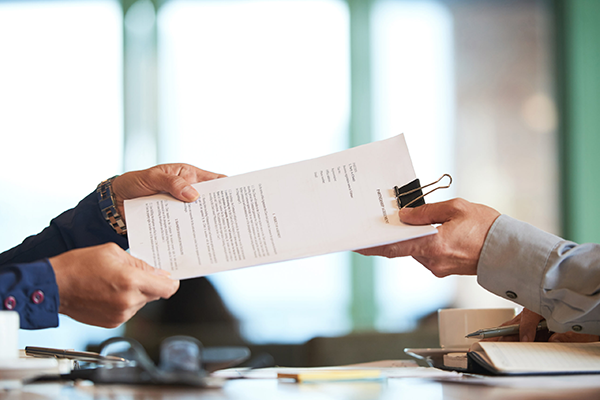 Car accident lawyer handing over contract